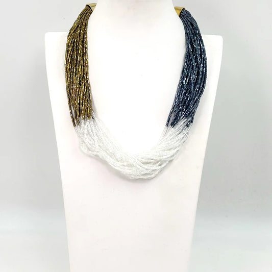 A Shimmering Multistrand beaded necklace In Gold, Blue & Clear